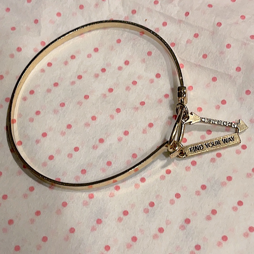 BCBGeneration “find your way” gold bangle.